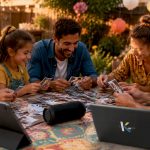 Family preparing slideshow with music at home