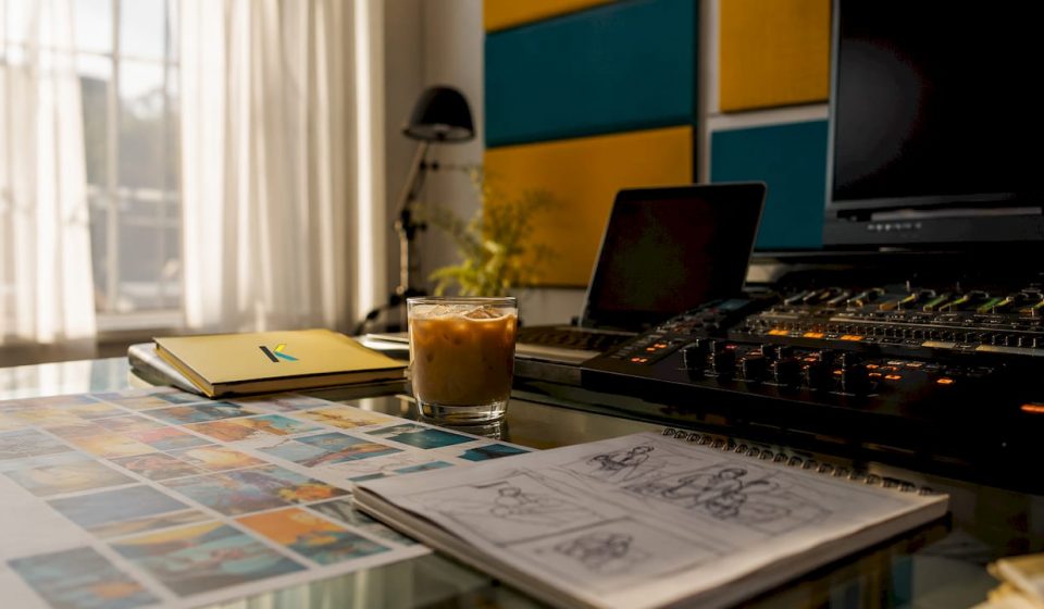 Old-style video editing desk with reels and notes