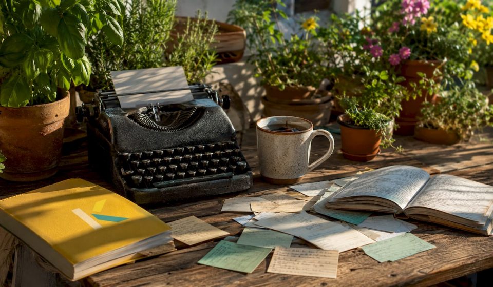 Vintage typewriter on rustic kitchen table with notes
