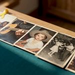 Vintage printed stills arranged on wooden table