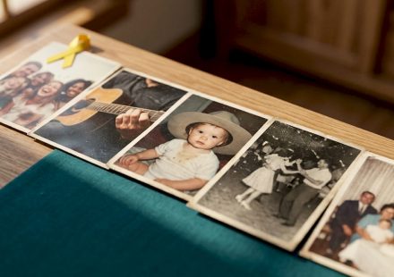 Vintage printed stills arranged on wooden table