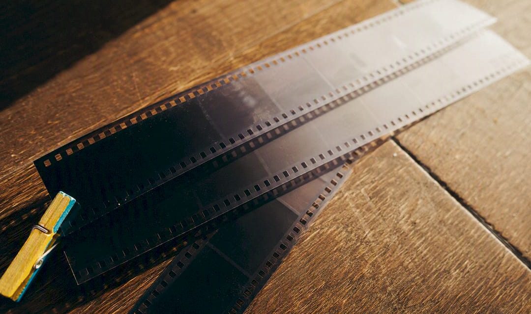 Old film strips fading from dark to light