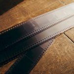Old film strips fading from dark to light