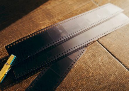 Old film strips fading from dark to light