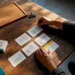 Hands arranging a presentation storyboard template