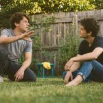 Friends rehearsing a backyard movie scene