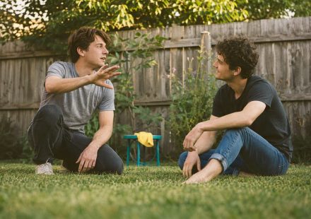 Friends rehearsing a backyard movie scene