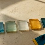 Five colored tiles arranged in sequence